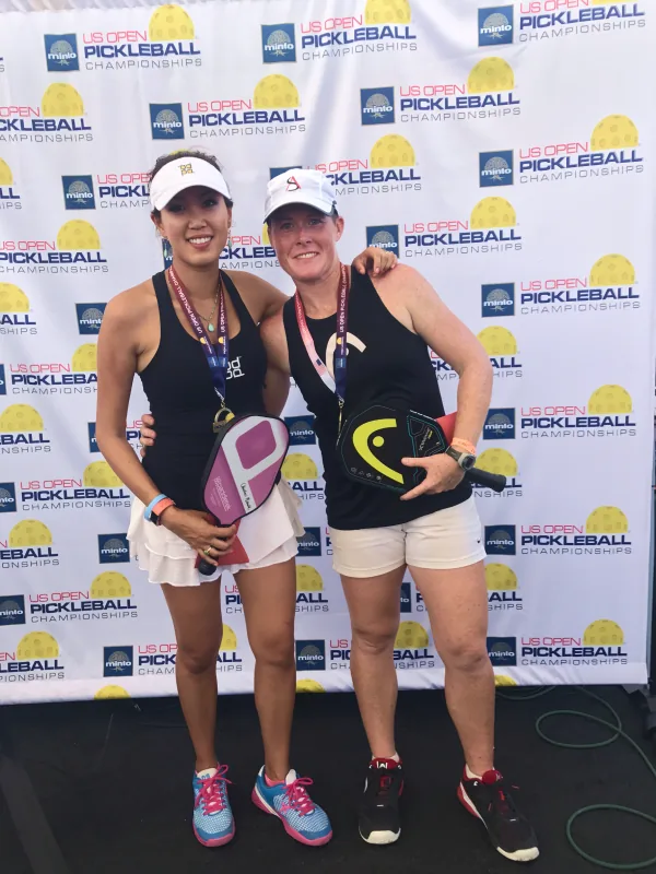 Sarah Ansboury with her doubles partner after a match