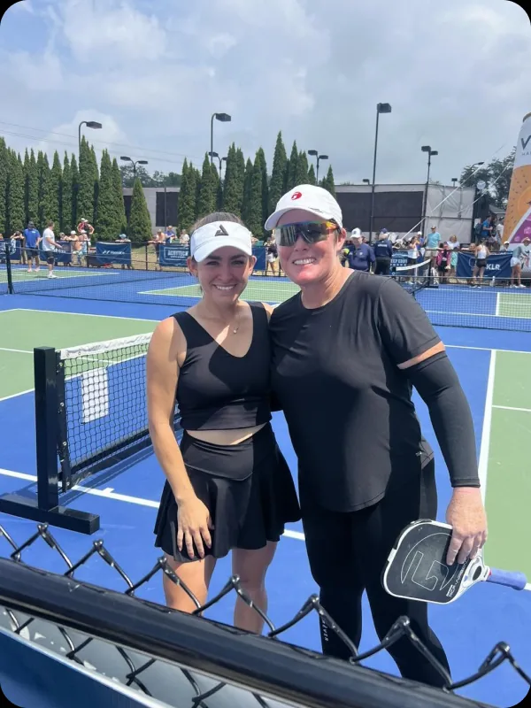 Sarah Ansboury with a player courtside