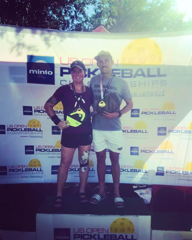 Sarah Ansboury in front of a tournament backdrop